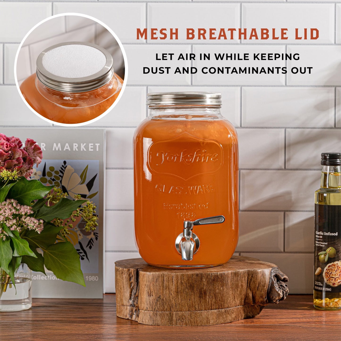 1 gallon kombucha dispenser tapping a glass