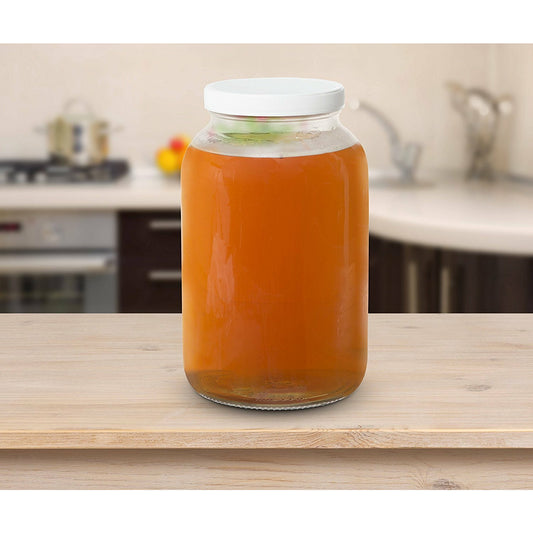 Kombucha jar with breathable cloth cover for brewing
