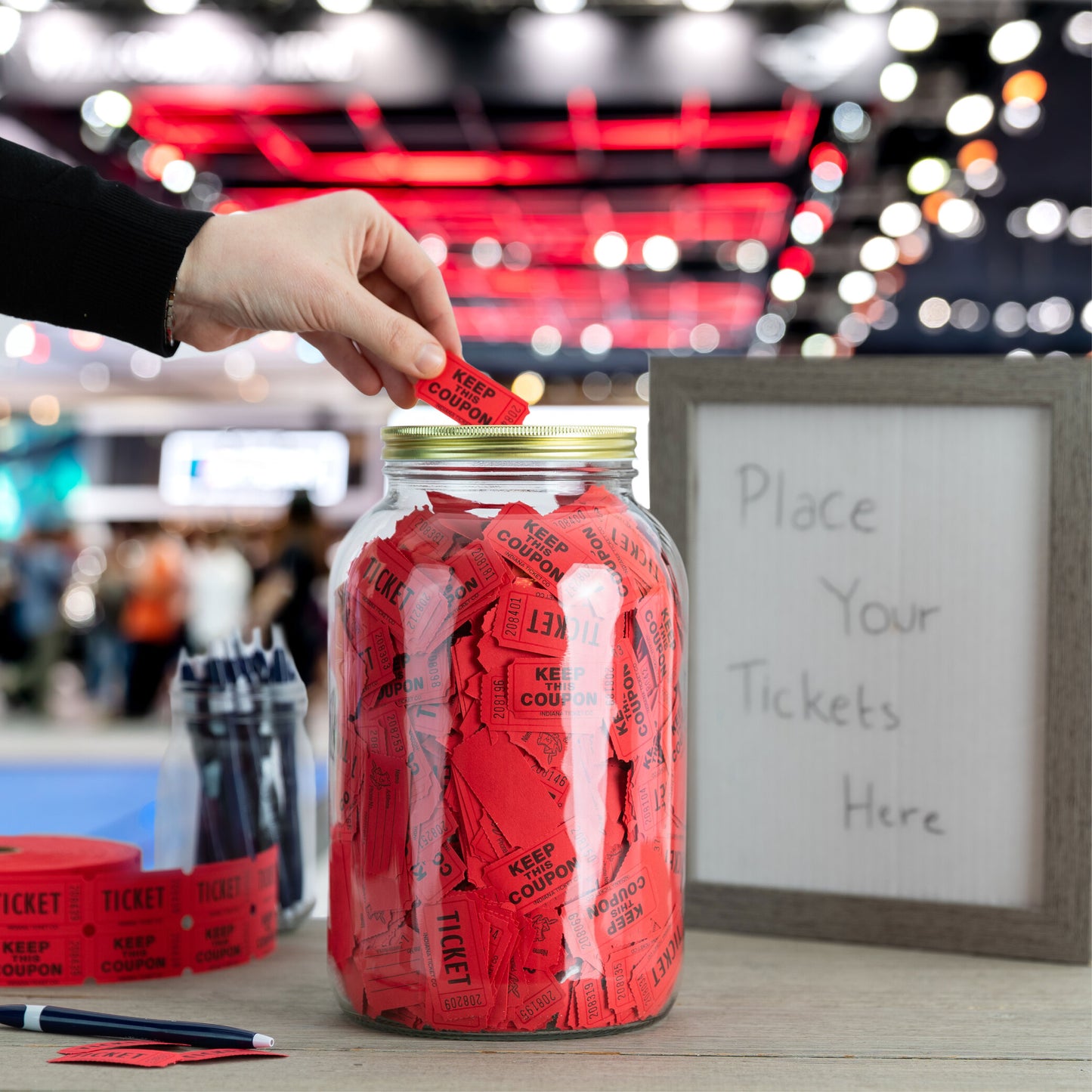 Glass coin bank filling with savings